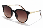 Eyelevel-UK Robyn oversized round sunglasses with brown tortoiseshell frame, gold temples, and brown gradient lenses.