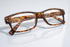 Eyelevel-UK Samuel Brown reading glasses with a brown tortoiseshell square plastic frame and clear magnifying lenses.