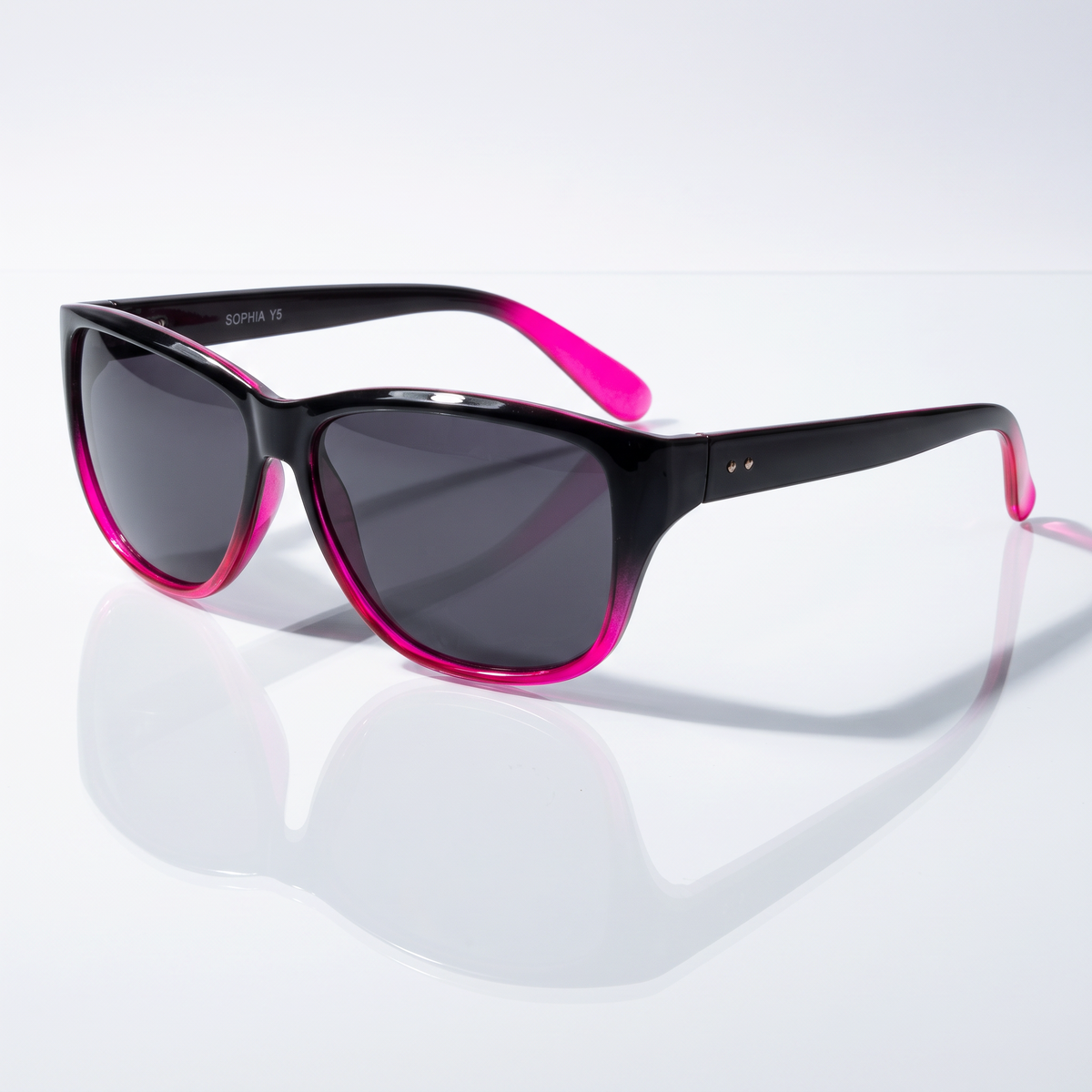 Eyelevel-UK Sophia rectangular polarized sunglasses in black and pink with grey lenses on a reflective white surface