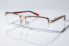 Eyelevel-UK Sovereign gold and brown semi-rimless rectangular reading glasses with clear magnifying lenses.