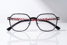 Eyelevel-UK St Kitts reading glasses with translucent grey square frames and patterned black and red temples.