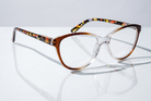 Eyelevel-UK St Lucia reading glasses with a brown and clear gradient cat eye frame and patterned temples.