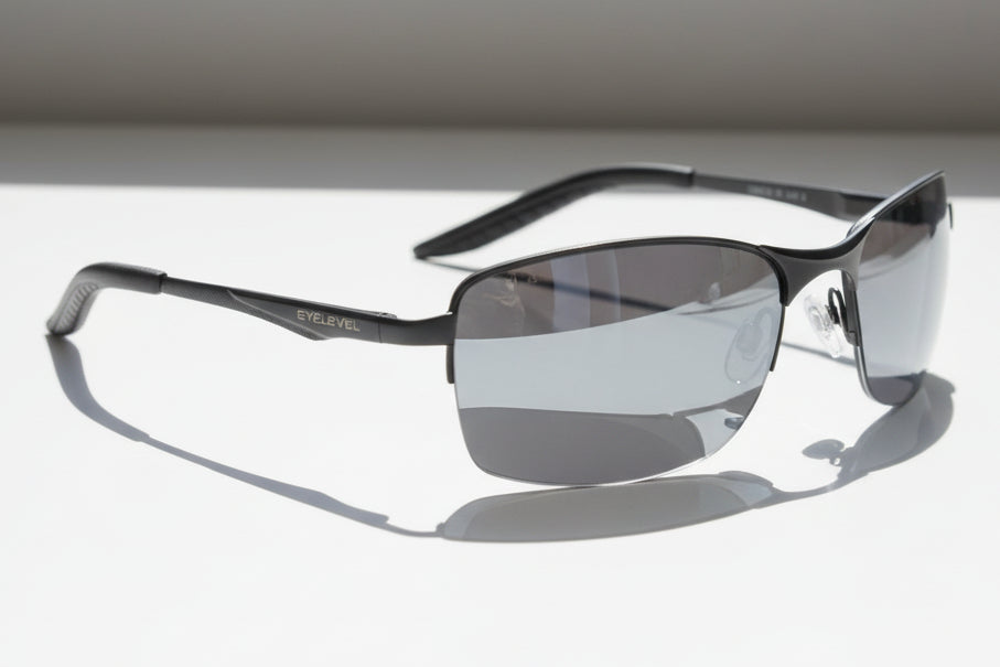 A pair of sunglasses with a gunmetal frame and grey lenses, suitable for men, from the Classic Men's Collection.